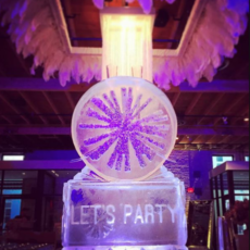 ice sculpture with Let's Party etched on bottom column
