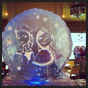 Frozen themed ice sculpture, circular with Elsa and Anna; by Full Spectrum Ice Sculptures, serving Austin to San Antonio