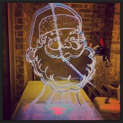 Santa Claus face ice luge by Full Spectrum Ice Sculptures
