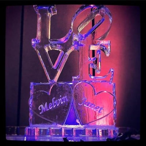 LOVE letters on top of two hearts with names etched in the middle, two-block sculpture for wedding, by Full Spectrum Ice Sculptures